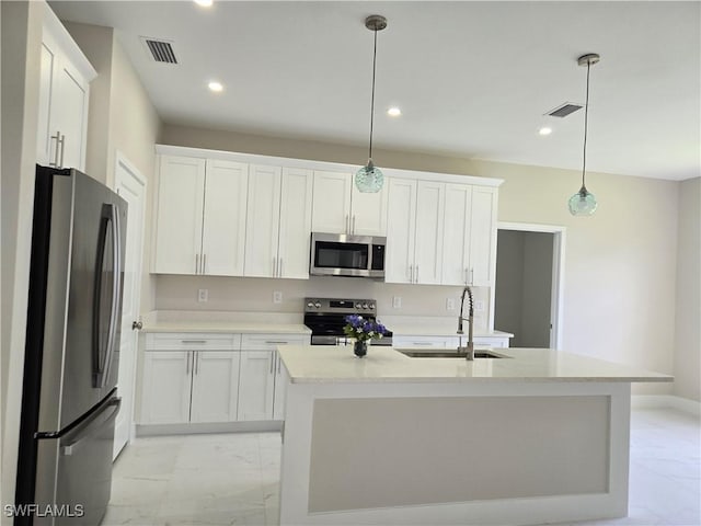 222 Victoria Ave S, Lehigh Acres, FL 33974 - kitchen featuring stainless steel appliances, a sink, light marble finish flooring, white cabinets, and recessed lighting
