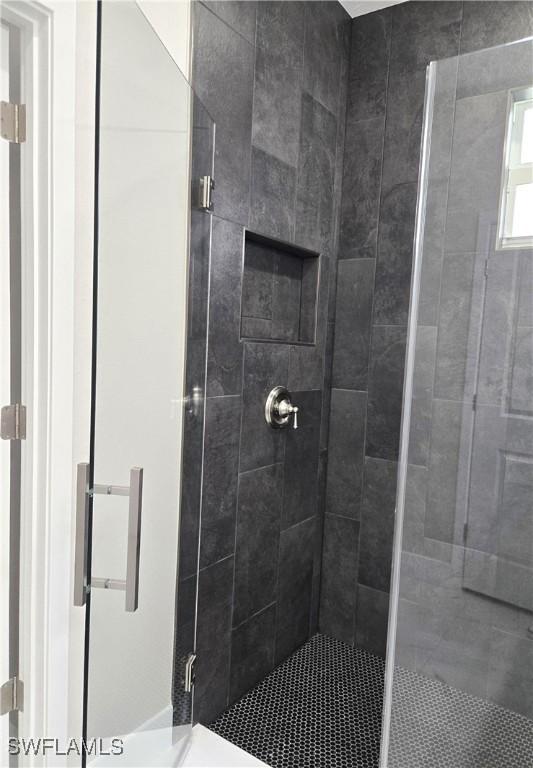 222 Victoria Ave S, Lehigh Acres, FL 33974 - bathroom featuring a stall shower