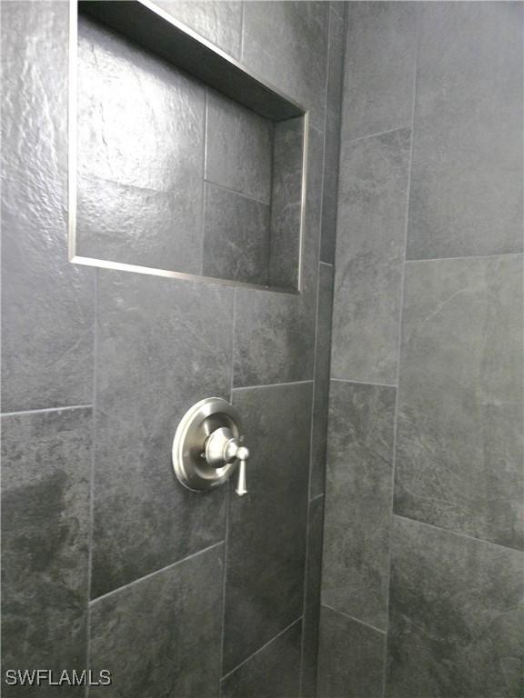 222 Victoria Ave S, Lehigh Acres, FL 33974 - bathroom view of a tile shower