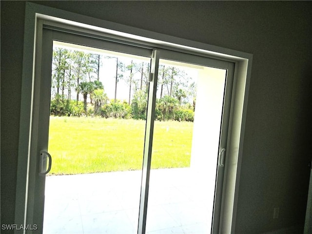 222 Victoria Ave S, Lehigh Acres, FL 33974 - doorway to outside featuring marble finish flooring