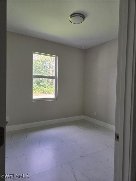 222 Victoria Ave S, Lehigh Acres, FL 33974 - unfurnished room with marble finish floors and baseboards