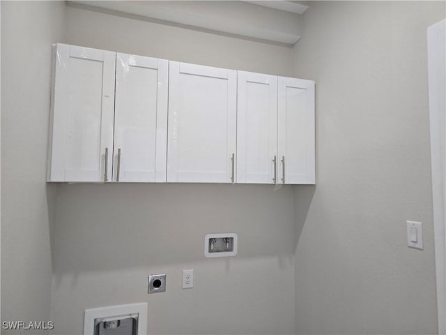 222 Victoria Ave S, Lehigh Acres, FL 33974 - laundry area with cabinet space, hookup for an electric dryer, and washer hookup