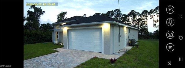 222 Victoria Ave S, Lehigh Acres, FL 33974 - garage with central air condition unit and decorative driveway