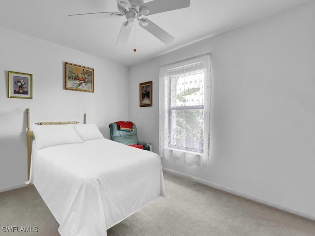333 SE 33rd Ter, Cape Coral, FL 33904 - bedroom with carpet flooring, baseboards, and ceiling fan