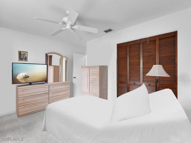 333 SE 33rd Ter, Cape Coral, FL 33904 - bedroom featuring light colored carpet, a closet, and ceiling fan