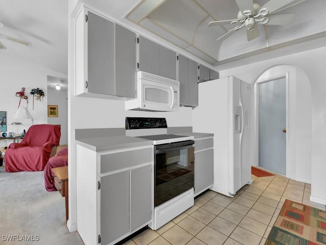 333 SE 33rd Ter, Cape Coral, FL 33904 - kitchen with white appliances, a ceiling fan, gray cabinets, arched walkways, and light tile patterned floors