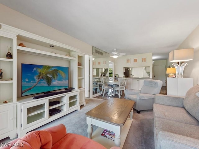 207 S Collier Blvd Unit 4-105, Marco Island, FL 34145 - carpeted living area featuring ceiling fan and built in features