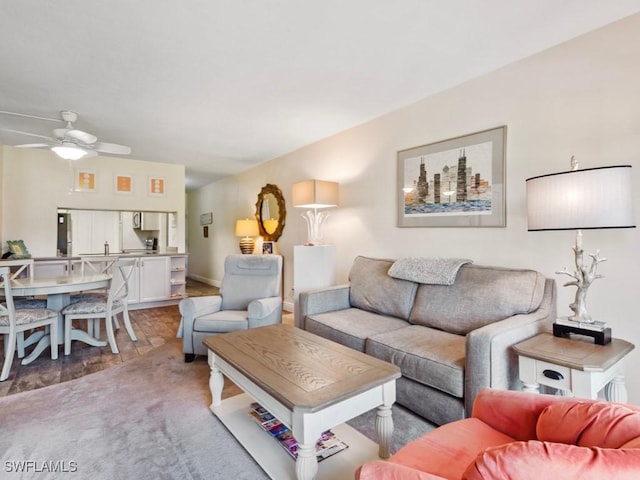 207 S Collier Blvd Unit 4-105, Marco Island, FL 34145 - living area with ceiling fan and light colored carpet