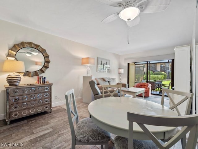 207 S Collier Blvd Unit 4-105, Marco Island, FL 34145 - dining space featuring wood finished floors, a ceiling fan, and baseboards
