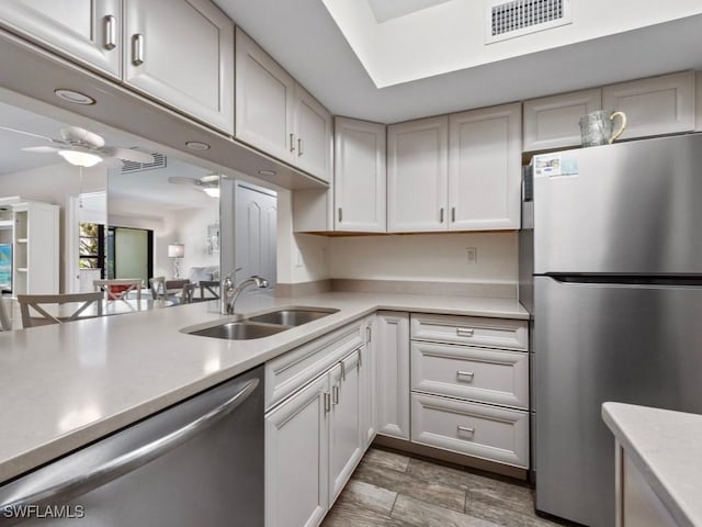 207 S Collier Blvd Unit 4-105, Marco Island, FL 34145 - kitchen featuring appliances with stainless steel finishes, a sink, light countertops, and a ceiling fan