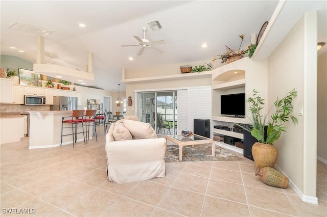 3708 SW 2nd Ln, Cape Coral, FL 33991 - living room with light tile patterned floors, a ceiling fan, recessed lighting, and lofted ceiling