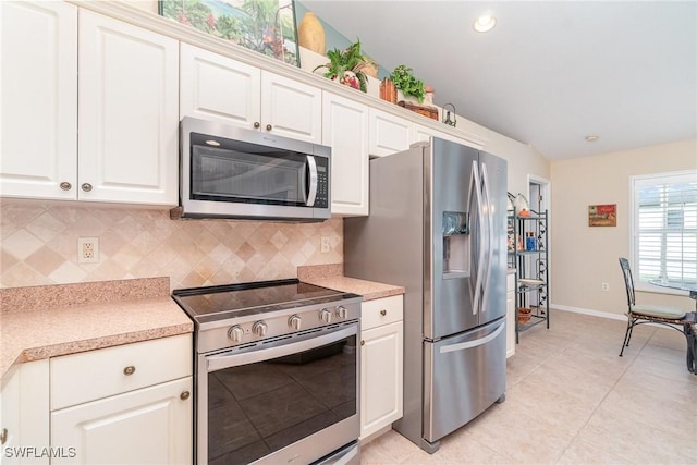 3708 SW 2nd Ln, Cape Coral, FL 33991 - kitchen with appliances with stainless steel finishes, backsplash, light countertops, white cabinetry, and recessed lighting