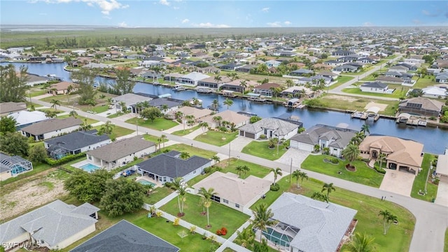 3708 SW 2nd Ln, Cape Coral, FL 33991 - aerial perspective of suburban area with a large body of water