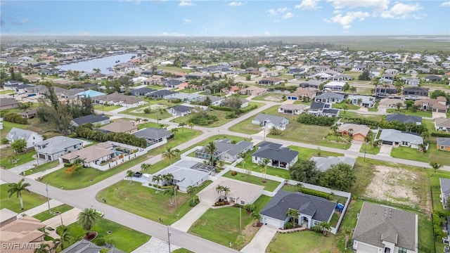 3708 SW 2nd Ln, Cape Coral, FL 33991 - aerial view of property and surrounding area with nearby suburban area and a nearby body of water