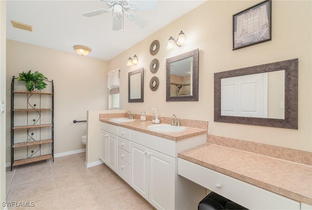3708 SW 2nd Ln, Cape Coral, FL 33991 - full bath featuring double vanity, toilet, a ceiling fan, tile patterned flooring, and baseboards