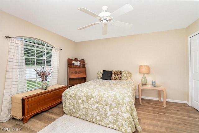3708 SW 2nd Ln, Cape Coral, FL 33991 - bedroom featuring light wood-type flooring, baseboards, and ceiling fan