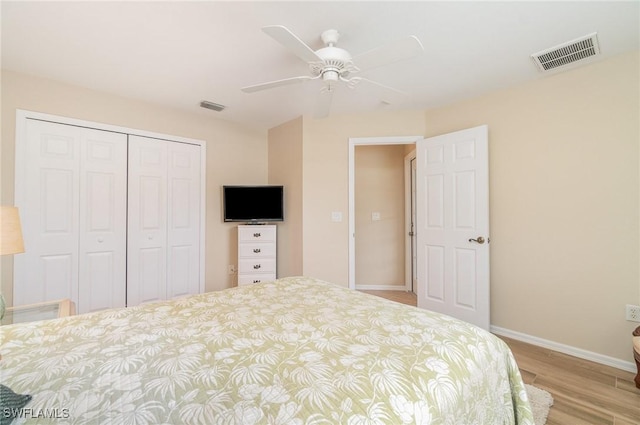 3708 SW 2nd Ln, Cape Coral, FL 33991 - bedroom with a closet, wood finished floors, baseboards, and a ceiling fan