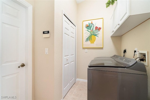 3708 SW 2nd Ln, Cape Coral, FL 33991 - laundry area featuring cabinet space, washer and dryer, light tile patterned floors, and baseboards
