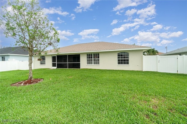 3708 SW 2nd Ln, Cape Coral, FL 33991 - rear view of house with stucco siding, a gate, and a sunroom