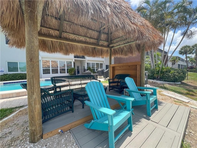 632 Victoria Dr Unit 103, Cape Coral, FL 33904 - wooden terrace with a gazebo, an outdoor pool, and a garage