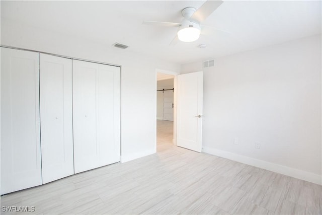 632 Victoria Dr Unit 103, Cape Coral, FL 33904 - unfurnished bedroom with a closet, light wood-type flooring, baseboards, and ceiling fan