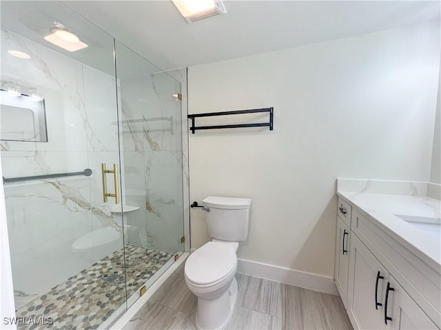 632 Victoria Dr Unit 103, Cape Coral, FL 33904 - bathroom featuring toilet, vanity, a marble finish shower, and baseboards