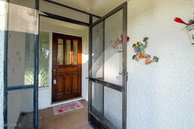 67 Pebble Beach Blvd, Naples, FL 34113 - view of exterior entry with stucco siding