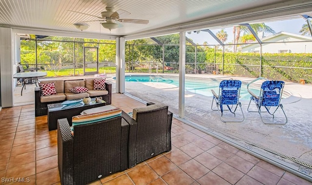 67 Pebble Beach Blvd, Naples, FL 34113 - swimming pool with outdoor lounge area, a patio area, a ceiling fan, and glass enclosure