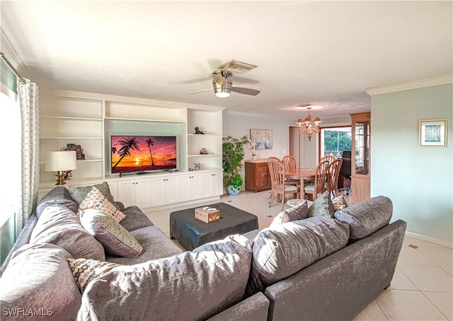 67 Pebble Beach Blvd, Naples, FL 34113 - living room featuring light tile patterned flooring, crown molding, a chandelier, a ceiling fan, and baseboards