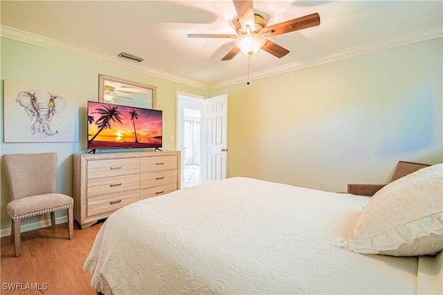 67 Pebble Beach Blvd, Naples, FL 34113 - bedroom with light wood-type flooring, ornamental molding, and ceiling fan