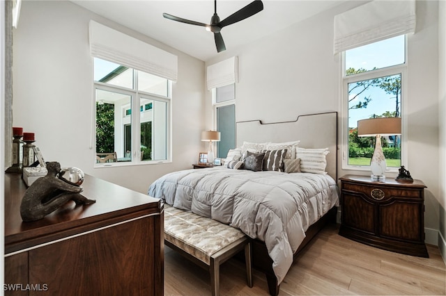 493 Myrtle Rd, Naples, FL 34108 - bedroom with multiple windows, light wood finished floors, and a ceiling fan