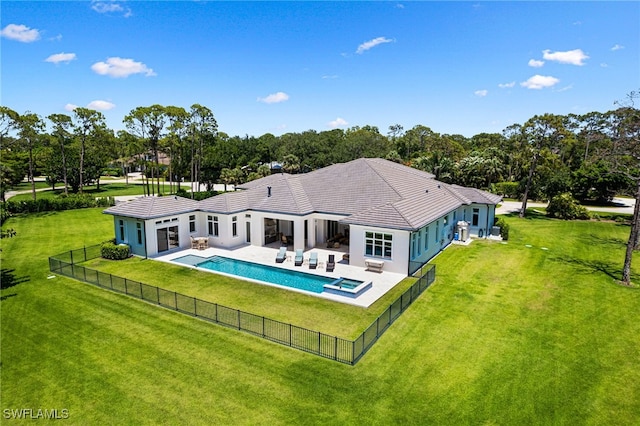 493 Myrtle Rd, Naples, FL 34108 - rear view of house with a patio, view of scattered trees, a pool with connected hot tub, a tile roof, and stucco siding