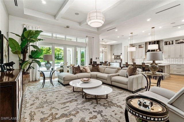 493 Myrtle Rd, Naples, FL 34108 - living area with a chandelier, light wood finished floors, beam ceiling, recessed lighting, and coffered ceiling