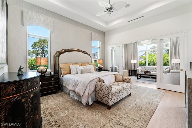 493 Myrtle Rd, Naples, FL 34108 - bedroom featuring light wood finished floors, wallpapered walls, and ceiling fan