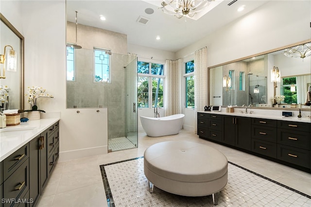 493 Myrtle Rd, Naples, FL 34108 - bathroom with a shower stall, tile patterned flooring, two vanities, and recessed lighting