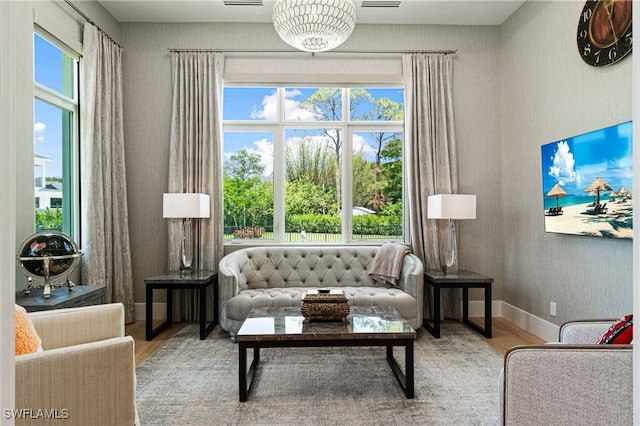 493 Myrtle Rd, Naples, FL 34108 - living area featuring wood finished floors and wallpapered walls