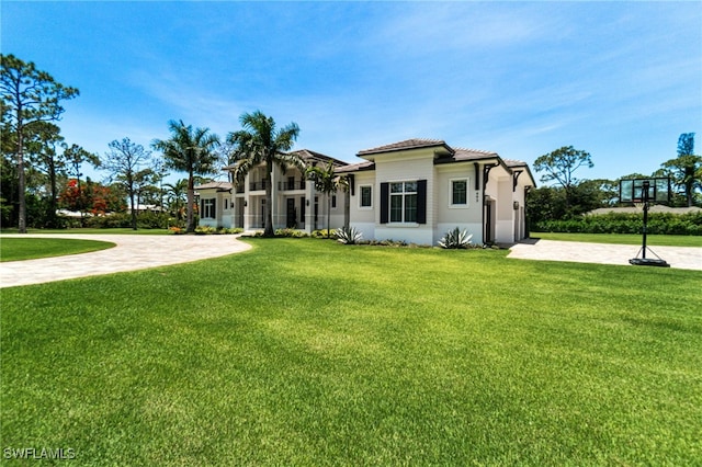 493 Myrtle Rd, Naples, FL 34108 - mediterranean / spanish house featuring a front yard, stucco siding, and driveway