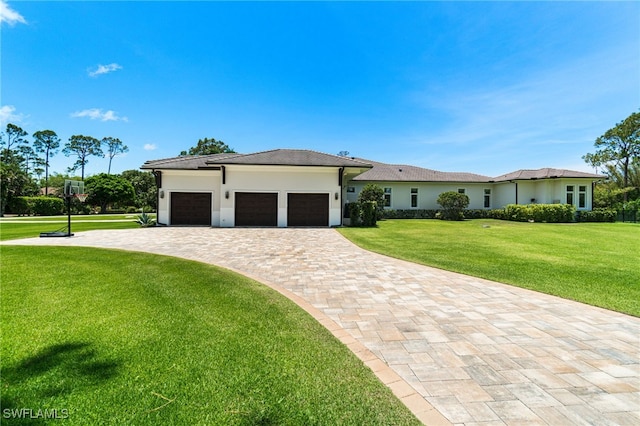 493 Myrtle Rd, Naples, FL 34108 - view of front facade with a front yard, a garage, decorative driveway, and stucco siding