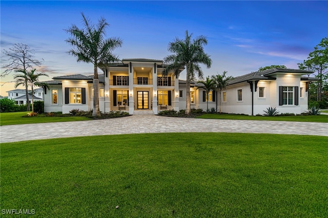 493 Myrtle Rd, Naples, FL 34108 - view of front of home featuring a front lawn, a balcony, and french doors