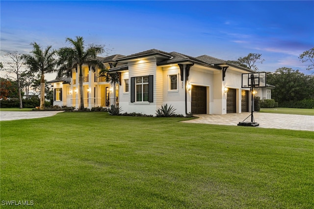 493 Myrtle Rd, Naples, FL 34108 - view of front facade featuring a balcony, a garage, a front yard, decorative driveway, and stucco siding