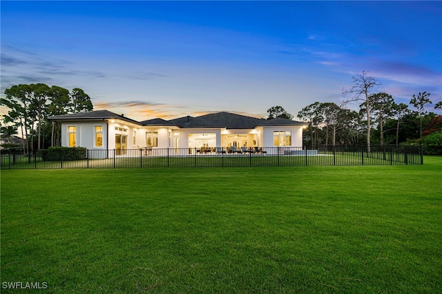 493 Myrtle Rd, Naples, FL 34108 - back of house at dusk featuring stucco siding