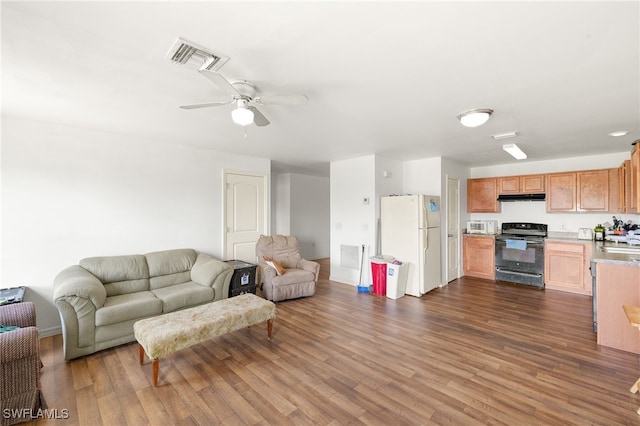 306 Wilmington Pkwy, Cape Coral, FL 33993 - living room featuring dark wood finished floors and ceiling fan