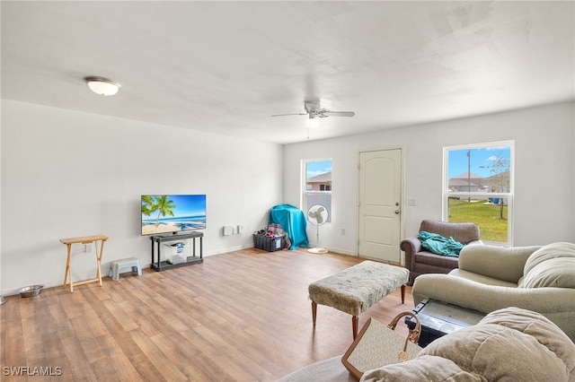 306 Wilmington Pkwy, Cape Coral, FL 33993 - living room with wood finished floors, plenty of natural light, ceiling fan, and baseboards