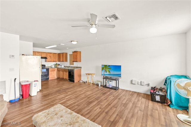 306 Wilmington Pkwy, Cape Coral, FL 33993 - living area with wood finished floors, ceiling fan, and baseboards
