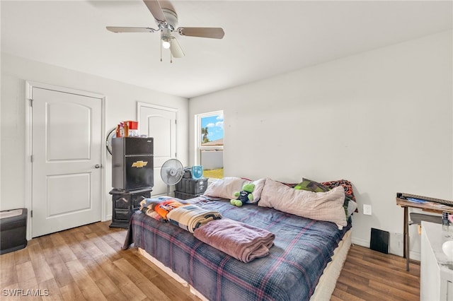 306 Wilmington Pkwy, Cape Coral, FL 33993 - bedroom with wood finished floors and a ceiling fan