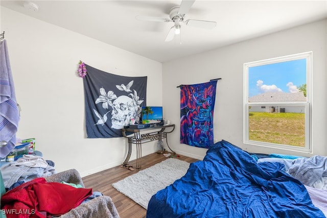 306 Wilmington Pkwy, Cape Coral, FL 33993 - bedroom with wood finished floors, baseboards, and ceiling fan