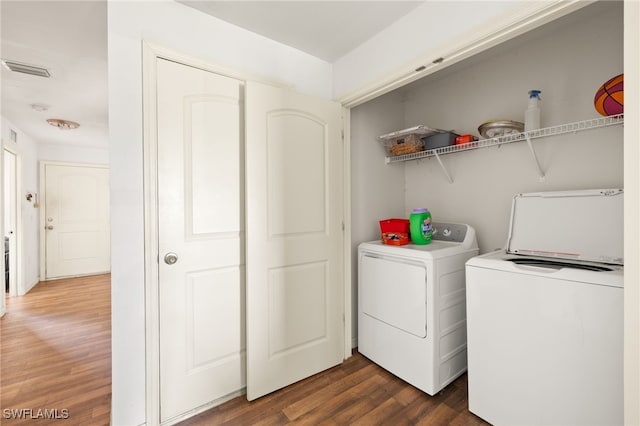 306 Wilmington Pkwy, Cape Coral, FL 33993 - laundry room featuring separate washer and dryer and dark wood-style flooring