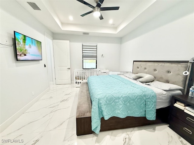 1719 NW 15th St, Cape Coral, FL 33993 - bedroom with light marble finish floors, baseboards, a tray ceiling, ceiling fan, and recessed lighting