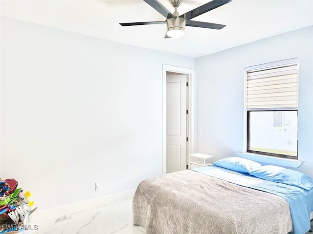 1719 NW 15th St, Cape Coral, FL 33993 - bedroom featuring baseboards, marble finish floors, and a ceiling fan