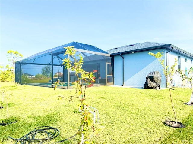 1719 NW 15th St, Cape Coral, FL 33993 - rear view of house featuring a yard and glass enclosure